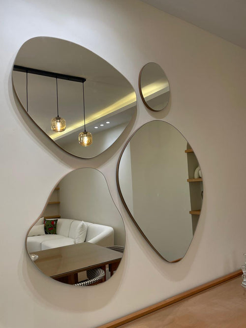 Modern interior design with circular mirrors on a wall, reflecting a living room.