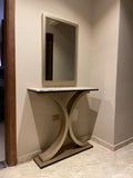 Modern console table with marble top against a wall