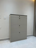 Gray filing cabinet against a plain wall