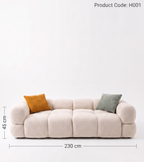 Beige sofa with two cushions on a white background, including dimensions.