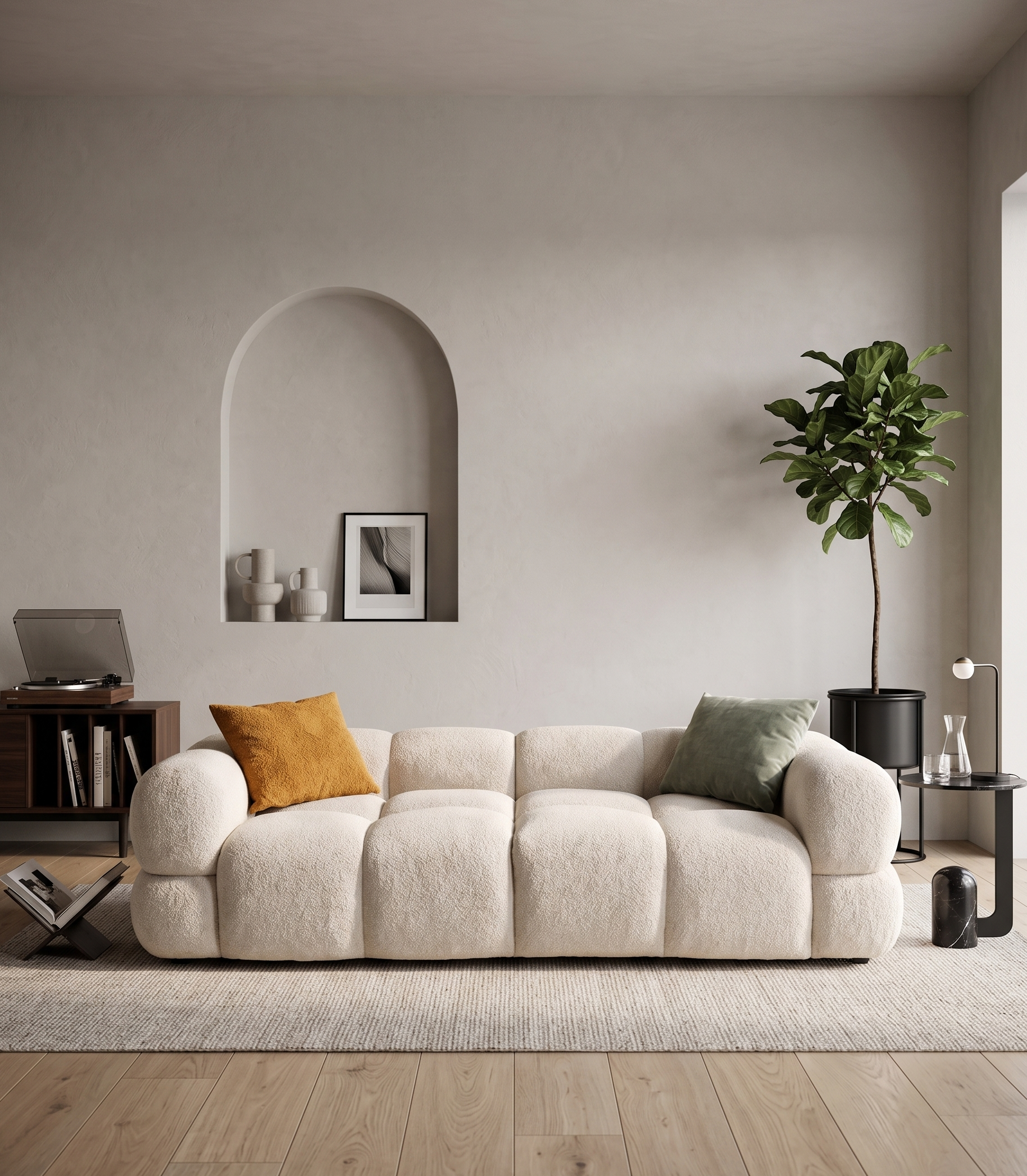 Modern living room with a beige sofa, decorative pillows, and a plant.